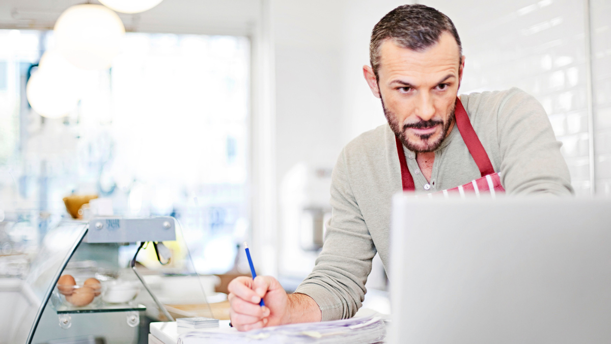 restaurant owner looking at data